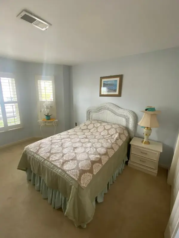 Bedroom with pale blue-gray walls and white windows, Bellevue, TN