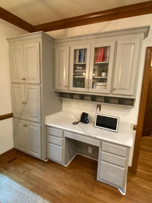 Gray built-in desk with glass-front upper cabinets and cubbies, Brentwood, TN