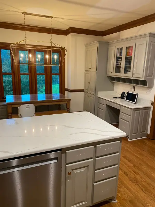 Gray island with drawer stack and white quartz top, Brentwood, TN