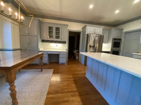 Long gray island beside a farmhouse table and desk wall, Brentwood, TN