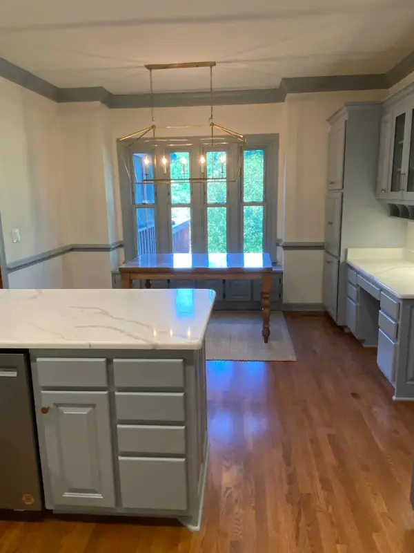 Gray cabinet run beside a breakfast room with gray window trim, Brentwood, TN