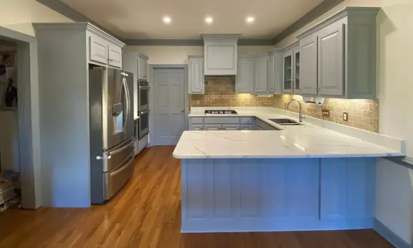 Wide view of a gray painted kitchen with stainless refrigerator, Brentwood, TN
