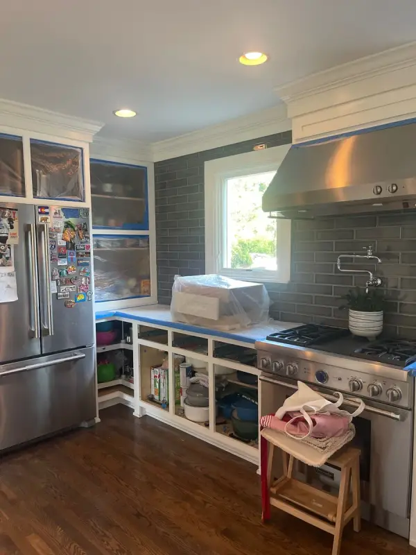 Range wall with doors off and counters taped, Brentwood, TN