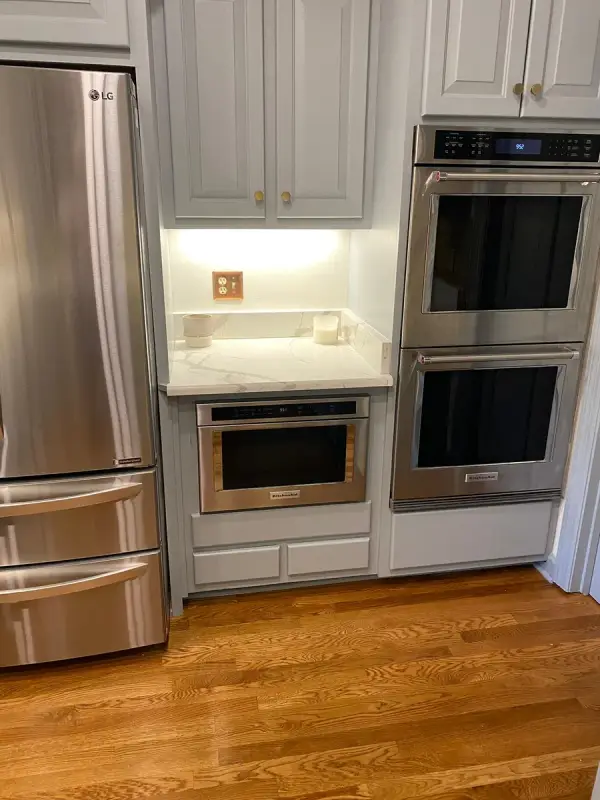 Gray cabinets framing stainless double wall ovens, Brentwood, TN