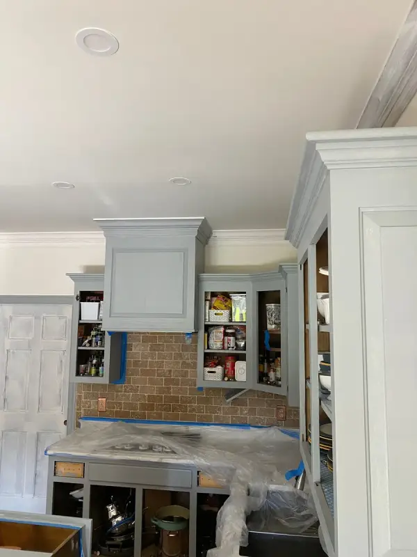 Primed uppers and hood surround in a kitchen masked for spraying, Brentwood, TN