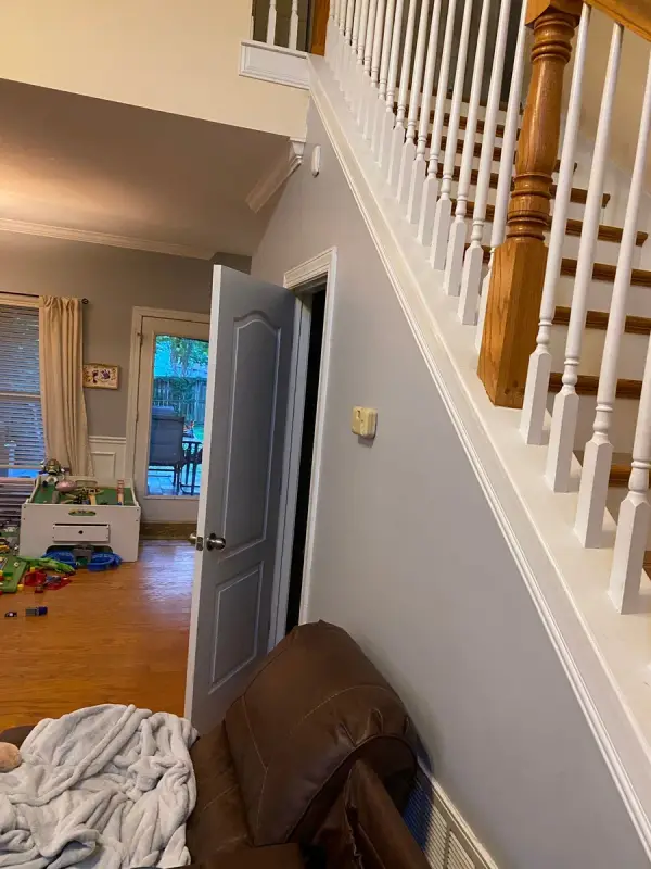 Stair with white spindles above a gray wall, Brentwood, TN