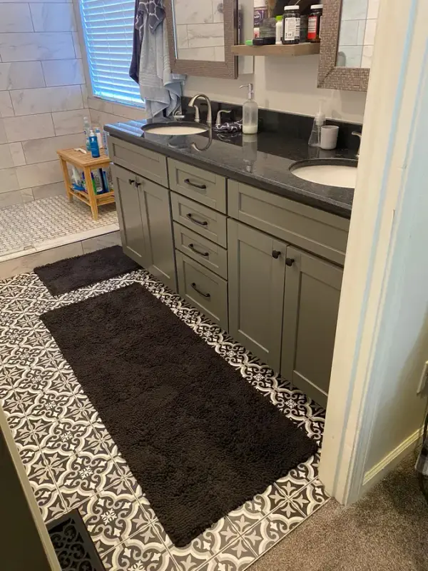 Gray-green vanity drawers and doors with black counter, side angle, Franklin, TN