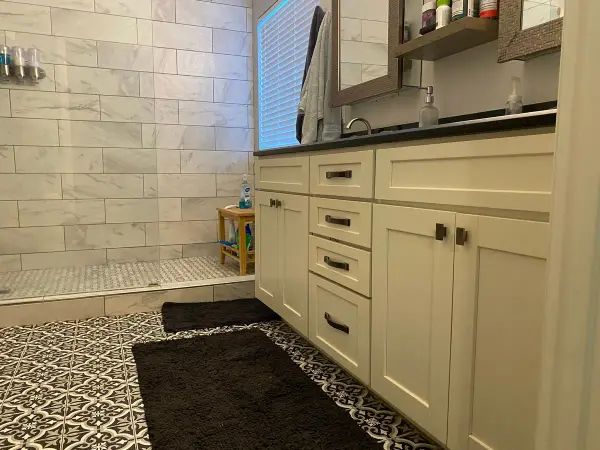 Cream vanity with black counter before painting, Franklin, TN
