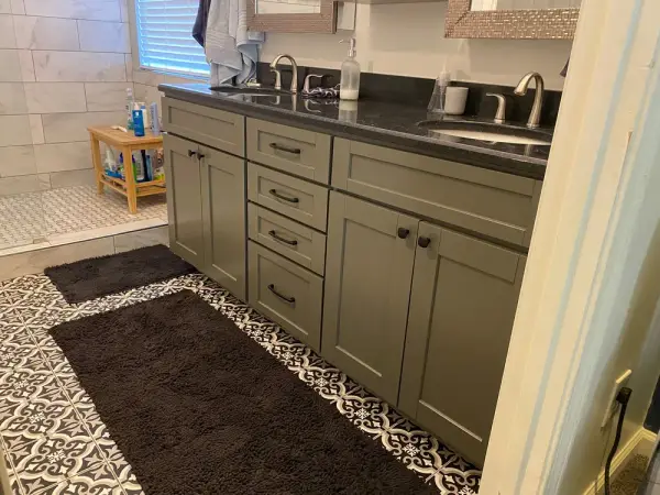 Gray-green double vanity with black counter and patterned floor, Franklin, TN