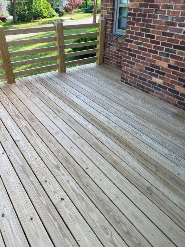 Bare deck corner against a brick wall, Belle Meade, TN