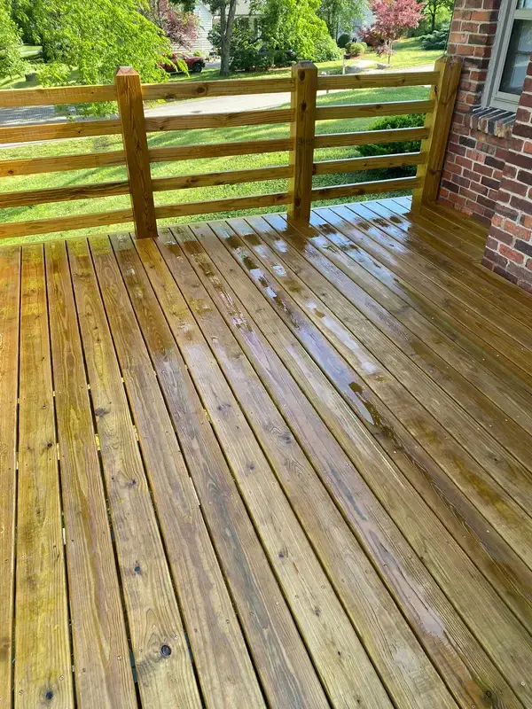 Deck boards wet after washing, railing beyond, Belle Meade, TN