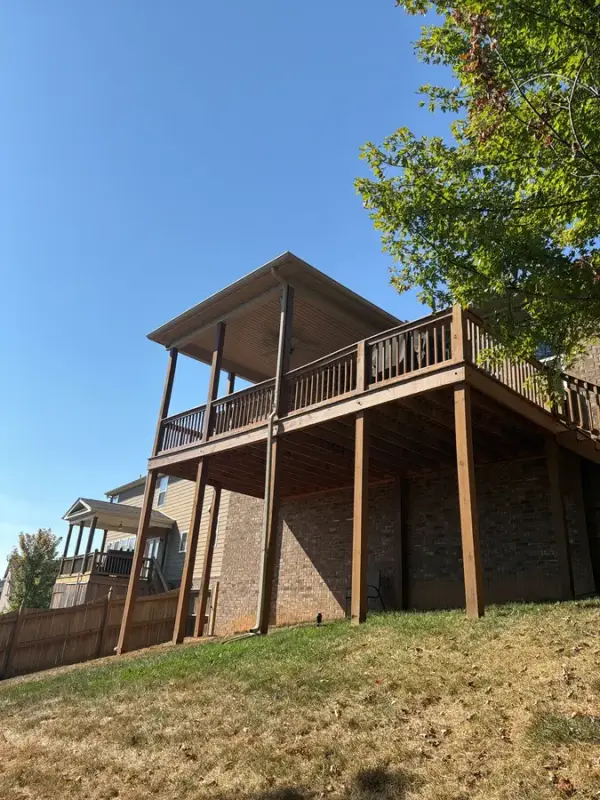 Raised deck on tall posts seen from below, Bellevue, TN