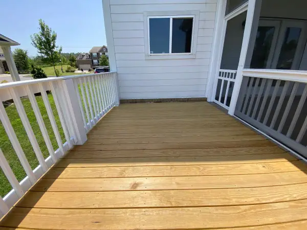Bare deck boards inside freshly painted white railings, Bellevue, TN