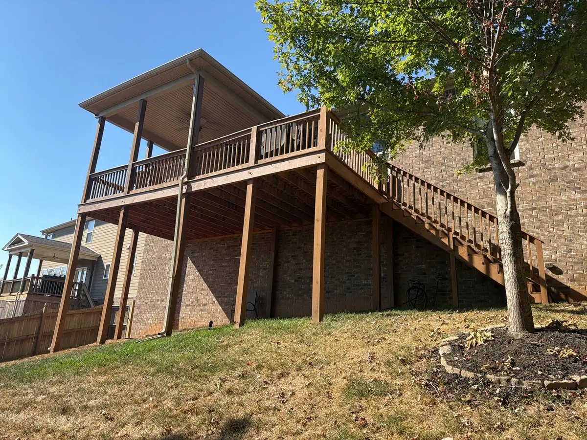 Raised stained deck and stair seen from the yard, Bellevue, TN