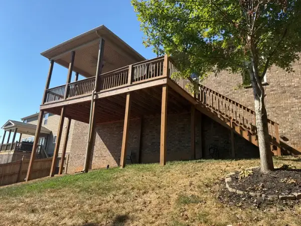 Raised stained deck and stair seen from the yard, Bellevue, TN