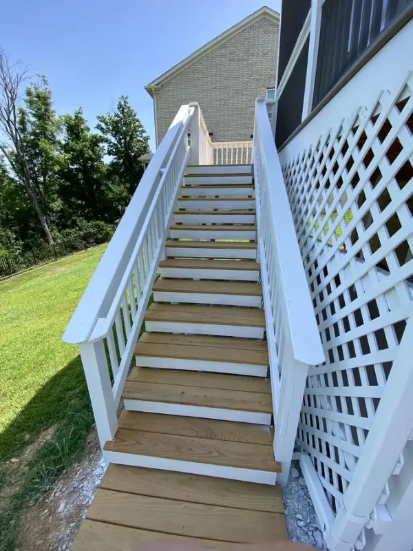 Long stair with white rails and lattice, brown-gray treads, Bellevue, TN