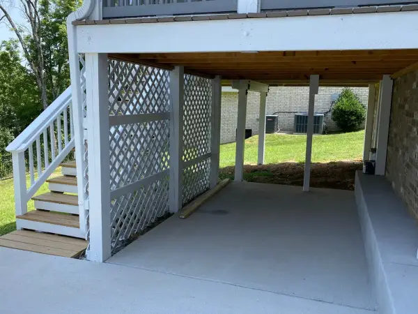 White lattice skirting and stair beside a covered patio, Bellevue, TN