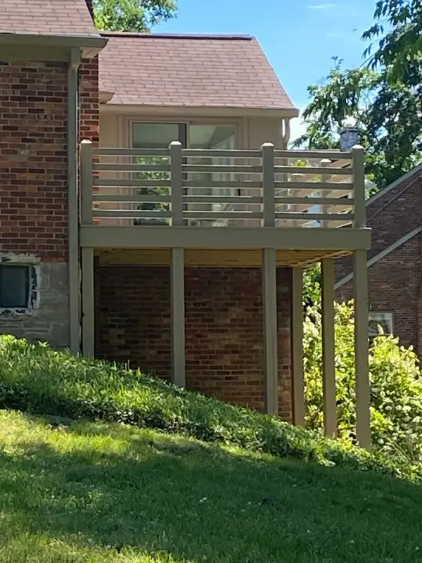 Stained elevated deck on tall posts seen from the yard, Belle Meade, TN