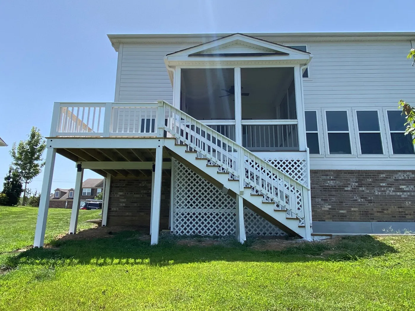 Finished deck with white railings and stair, brown-gray treads, Bellevue, TN