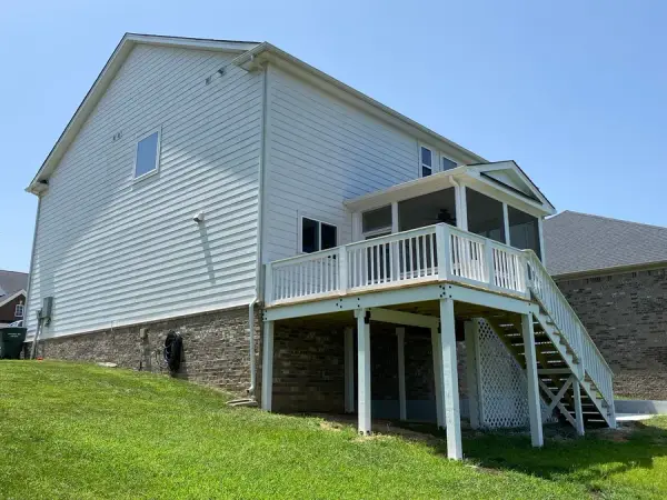 Deck with white railings and stair under a screened porch, Bellevue, TN