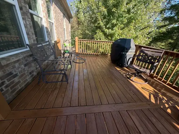 Stained deck boards and railing along a brick wall, Bellevue, TN