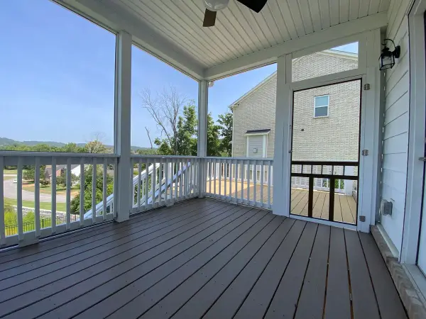 Screened porch with brown-gray floor and white rails, Bellevue, TN