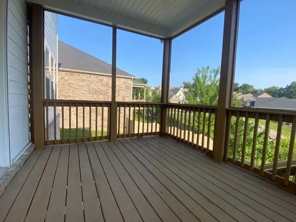 Screened porch with brown-stained posts and rails, Bellevue, TN
