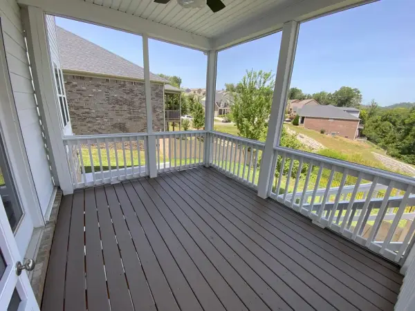Screened porch floor in brown-gray with white railings, Bellevue, TN