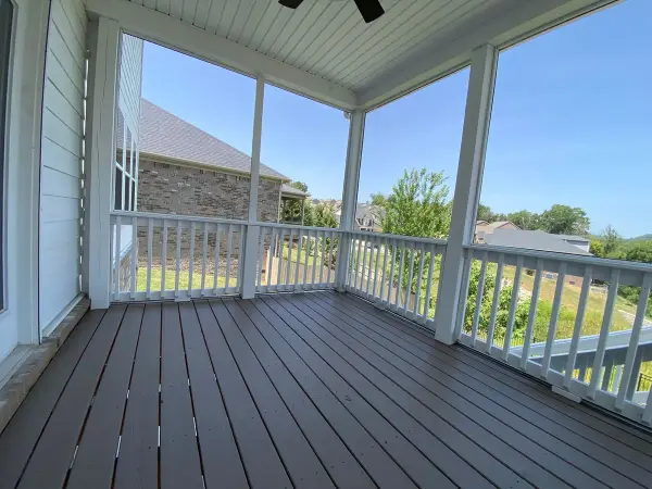 Screened porch with brown-gray floor and white railings, Bellevue, TN