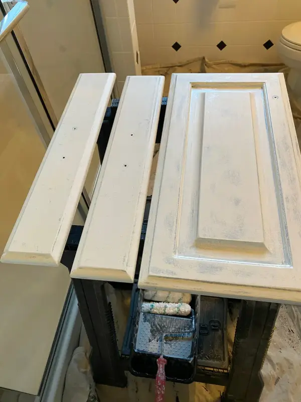Vanity door and drawer fronts primed white on a rack, Franklin, TN