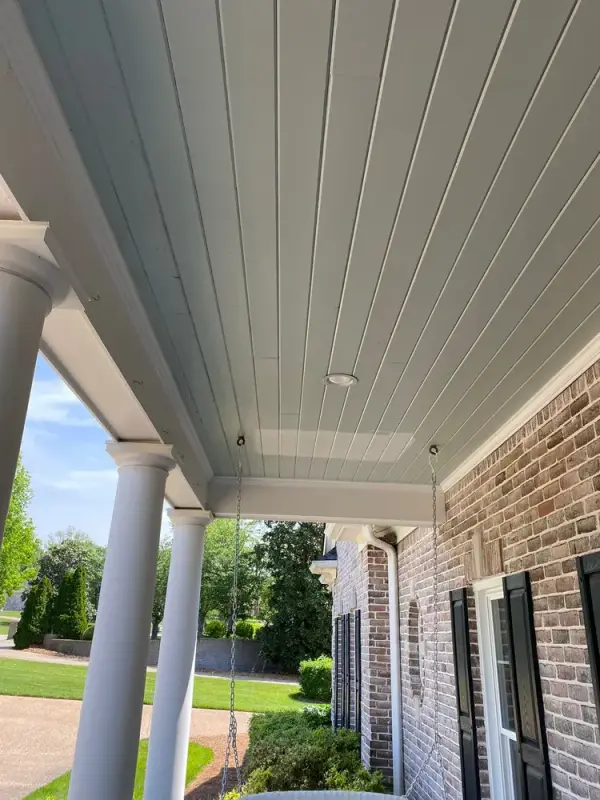 Round white porch columns under a pale blue ceiling, Franklin, TN