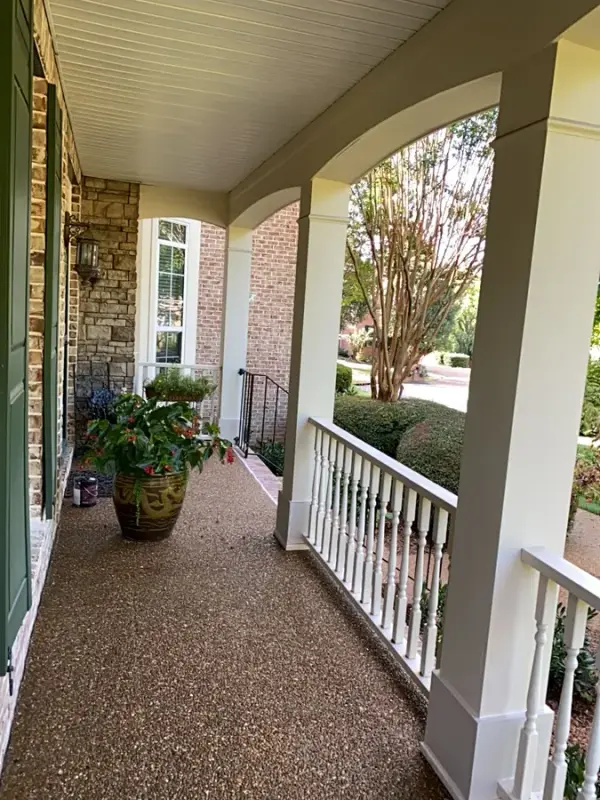 Covered porch with white columns, arched beams and white railing, Bellevue, TN