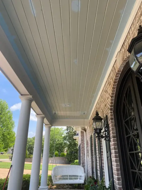 Pale blue porch ceiling along a brick front with lanterns, Franklin, TN