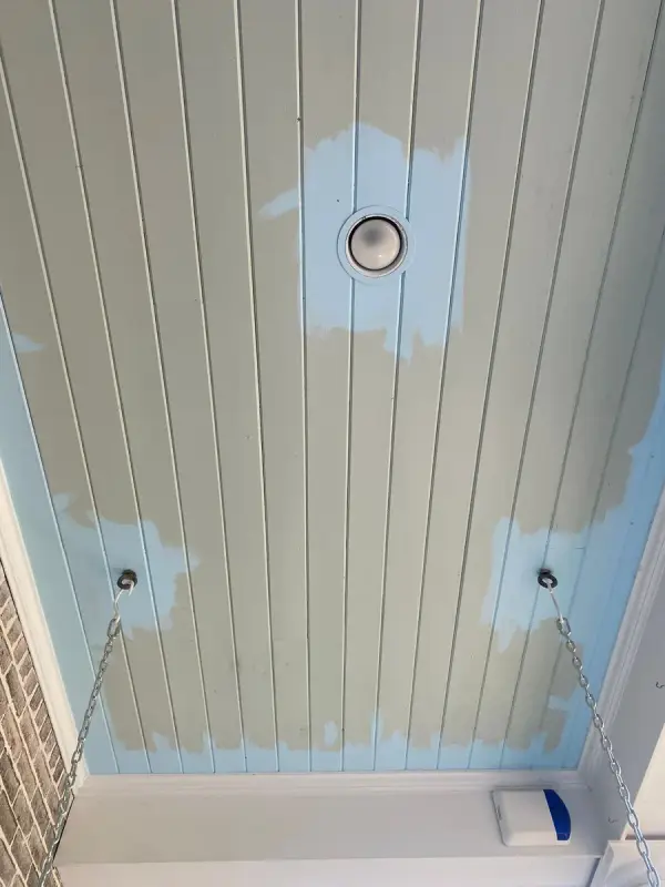 Pale blue porch ceiling with primer patches around lights, Franklin, TN