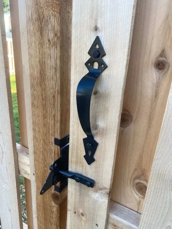 Black gate handle and latch on raw fence boards, Bellevue, TN