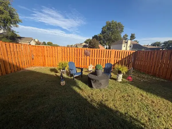 Stained fence around a backyard seating area, Bellevue, TN
