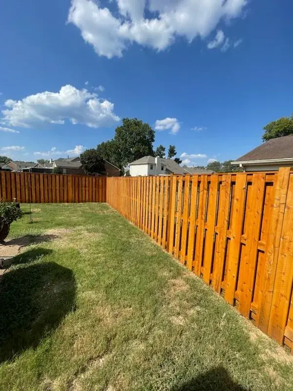 Stained fence corner along a side yard, Bellevue, TN