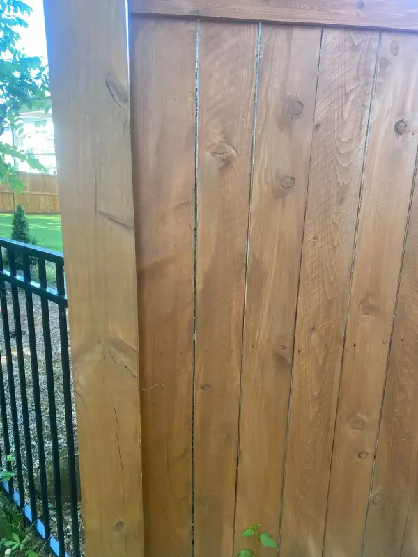 Close view of stained vertical fence boards, Thompson Station, TN