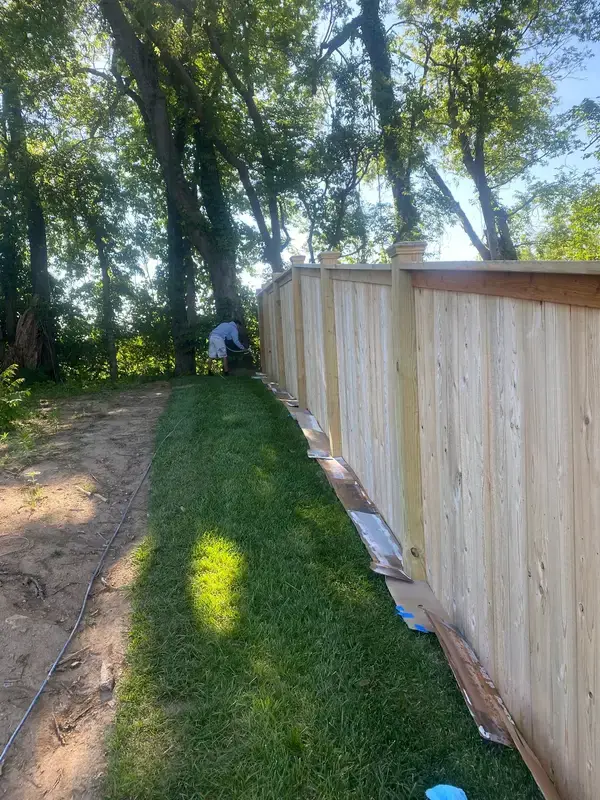 Raw privacy fence along a strip of bare soil, Thompson Station, TN