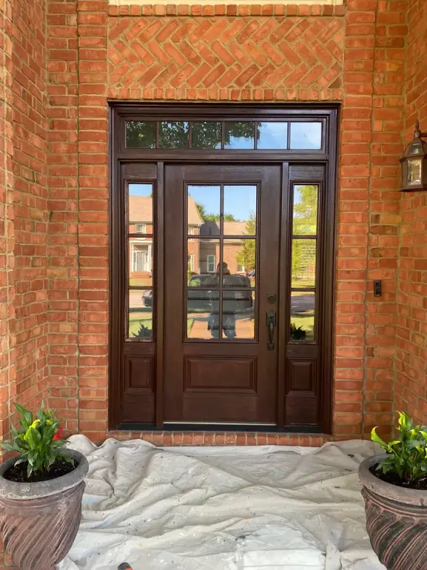 Dark-stained front door and sidelights in a brick entry, Franklin, TN