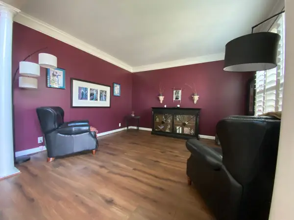 Burgundy sitting room with white crown, wide view, Bellevue, TN
