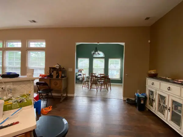 Tan dining area opening to a dark green breakfast room, Bellevue, TN