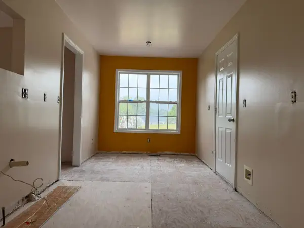 Marigold wall at the end of a long cream room, Pleasant View, TN