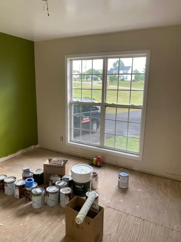 Olive green accent wall with paint cans on the floor, Pleasant View, TN