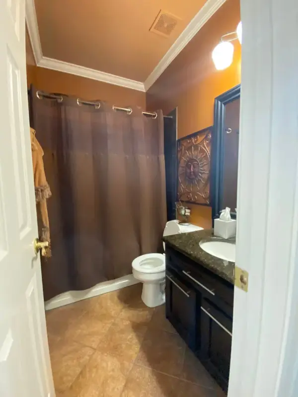 Hall bath with warm walls and white crown, Bellevue, TN