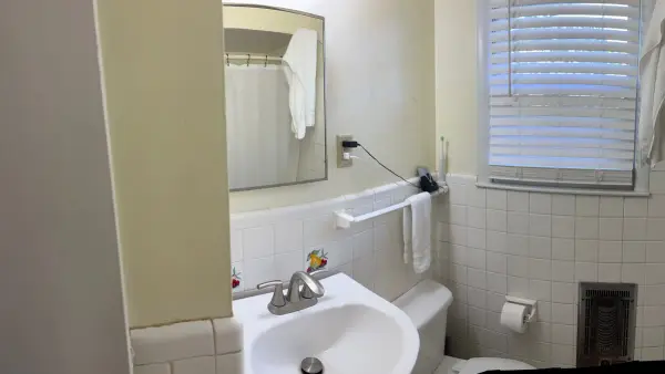Panorama of a bathroom with pale yellow walls and white trim, Brentwood, TN