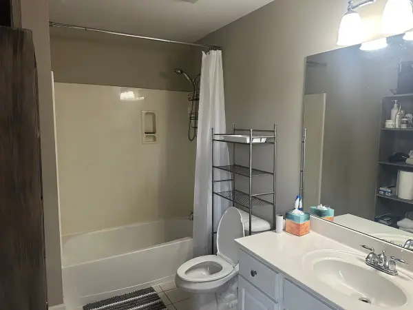 Bathroom with white tub surround and pale walls, Brentwood, TN