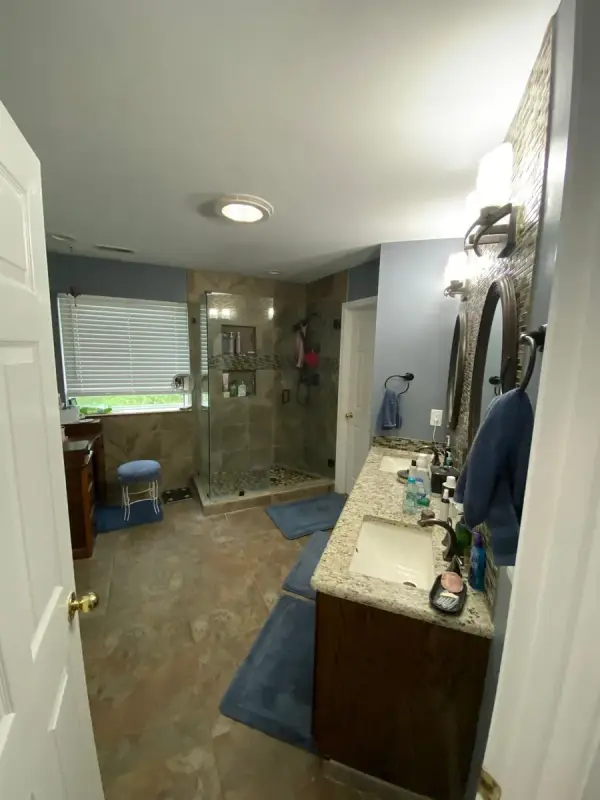 Primary bath with glass shower and pale walls, Brentwood, TN