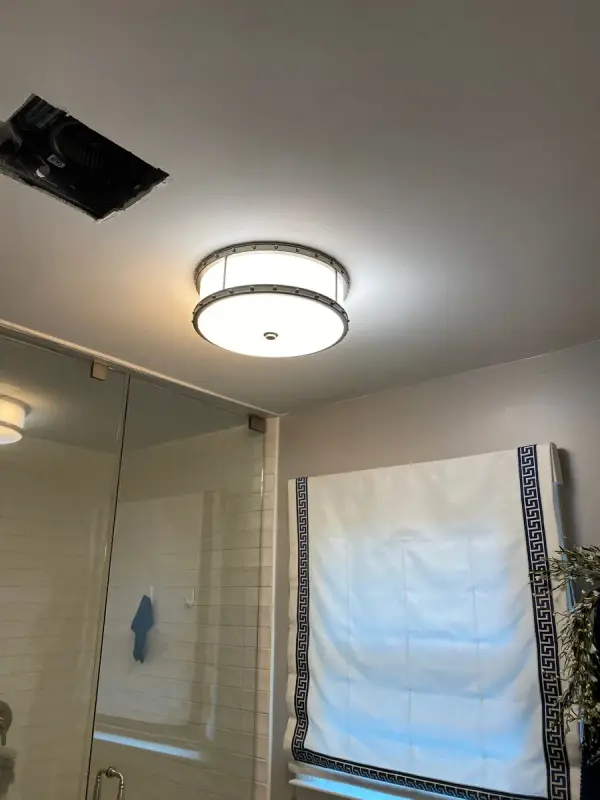Gray bathroom ceiling and walls beside a glass shower, Franklin, TN