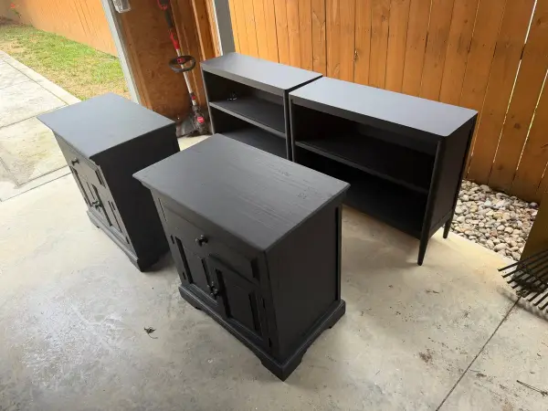 Black nightstands and bookcase set out on a patio, Belle Meade, TN